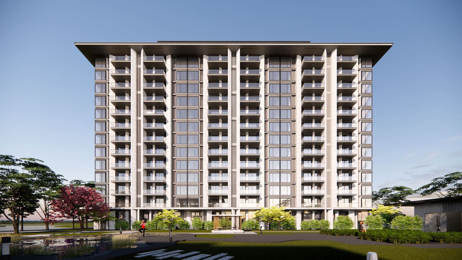 A modern high-rise apartment building against a clear sky